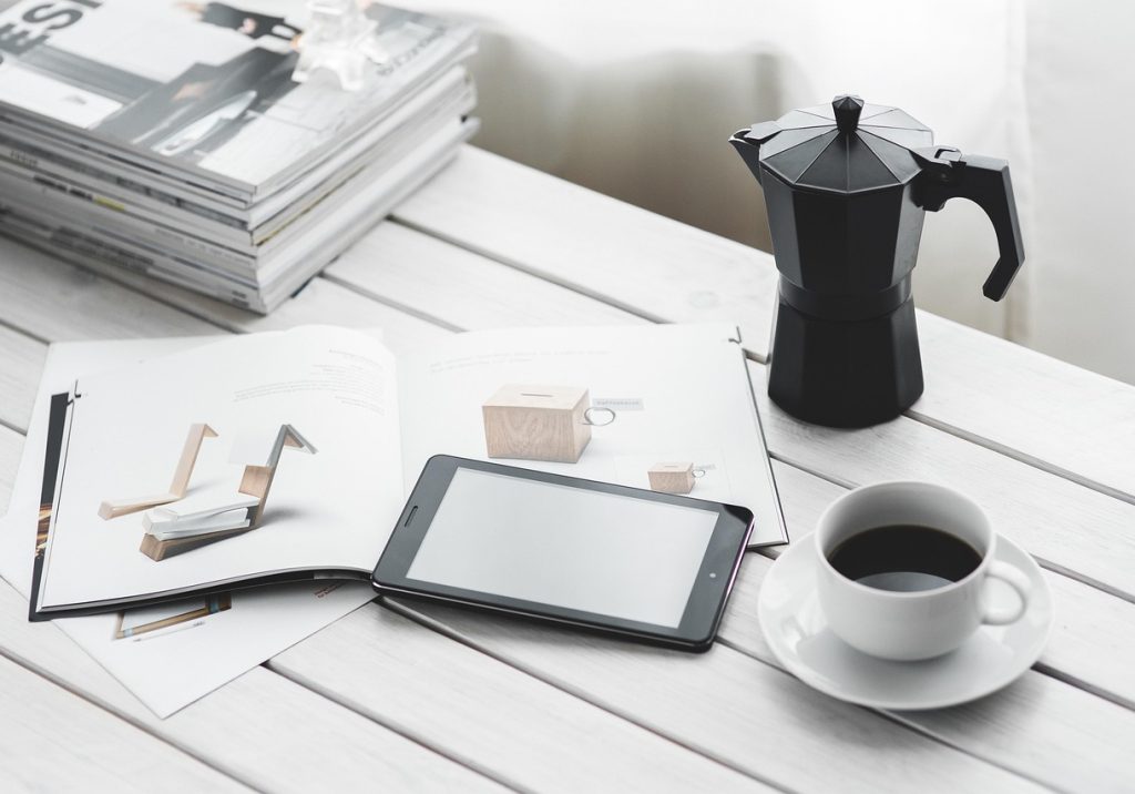 Technology, coffee cup, tablet — Unlocking Affordable Testosterone Replacement: A Review of Low-Cost Online TRT Clinics